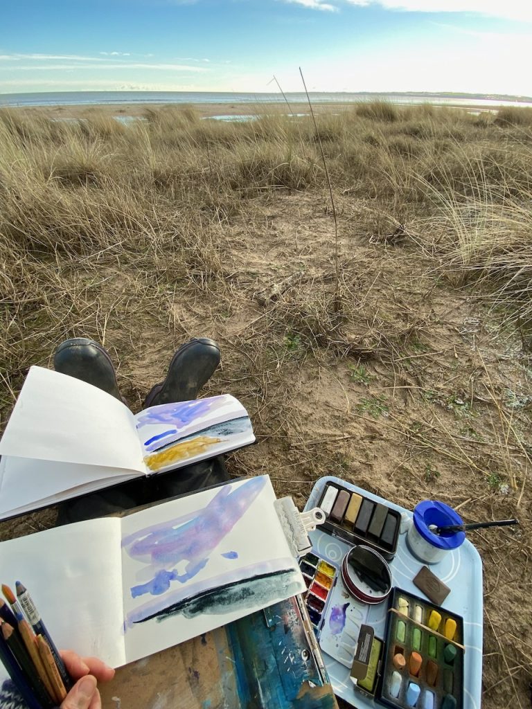 Sketching on a beach